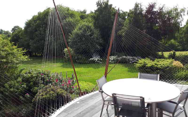 Tension wire suspended decking area