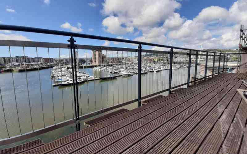 Vertical wire retrofit to pre existing railing system