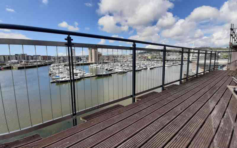 Vertical wire retrofit to pre existing railing system