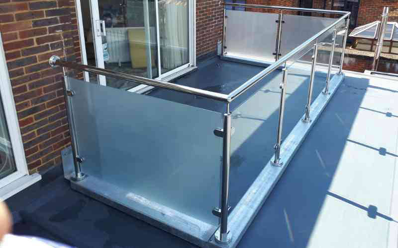 Etched privacy glass on stainless steel balustrade