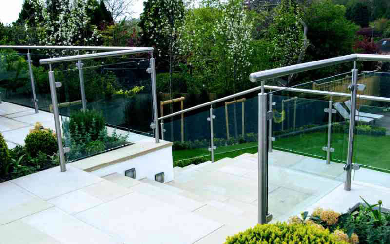 Stainless steel railings with glass and top rail