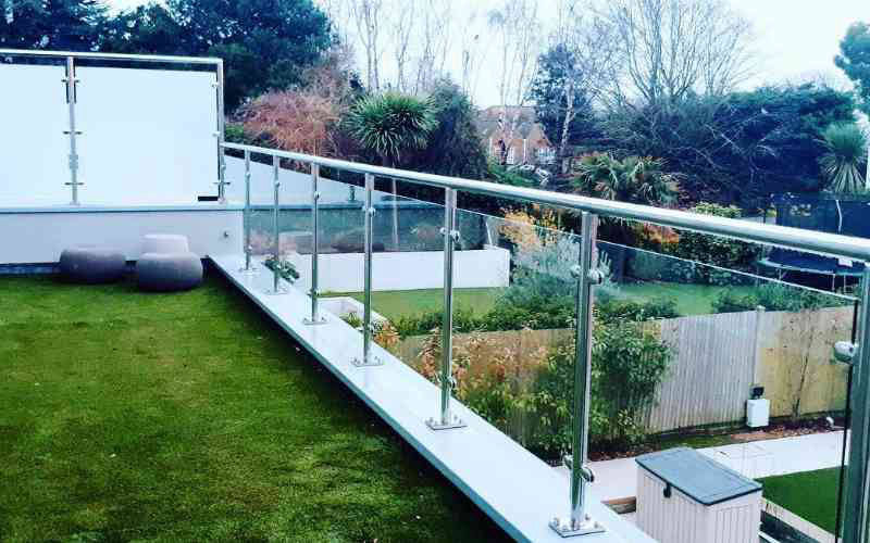 Stainless steel railings with glass and top rail