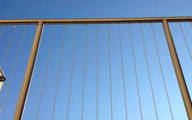 Stainless steel vertical wire infill balustrade with bright polished finish